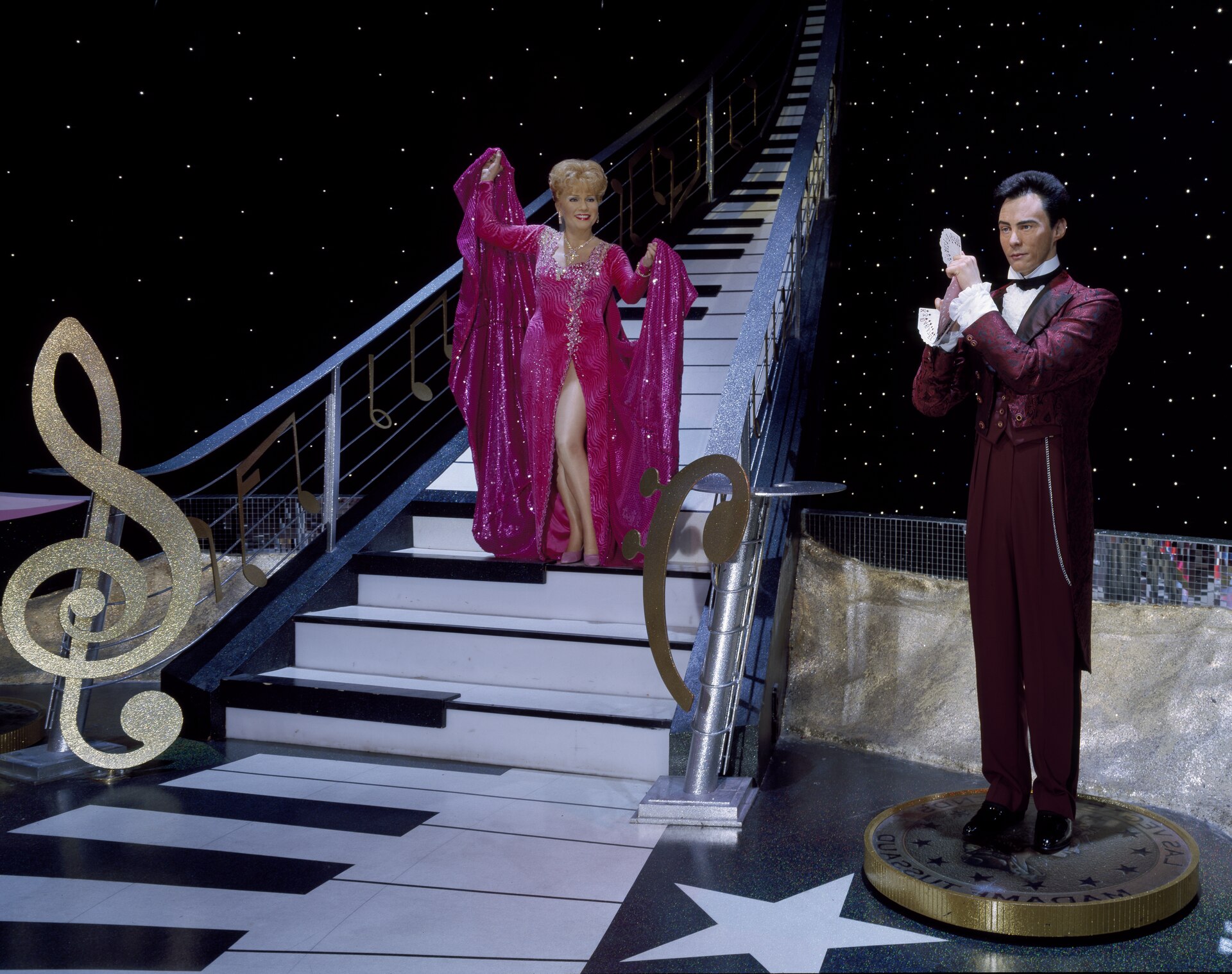 Lance Burton and his assistant performing on stage in Las Vegas