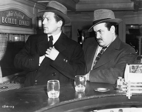 William Conrad, right, with Charles McGraw in a promotional still from The Killers, 1946
